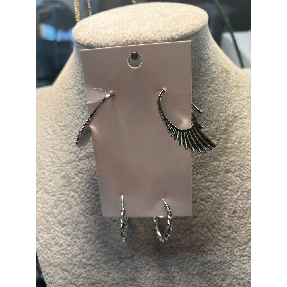 #17. Set silver-tone earrings Wings & Twisted Hoops